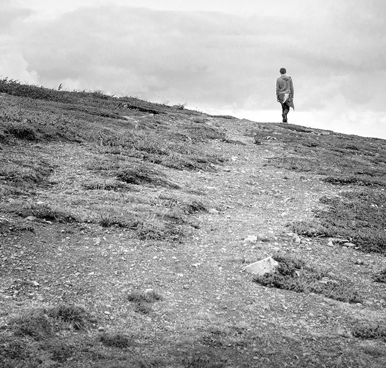 Hiker at the top of a hill