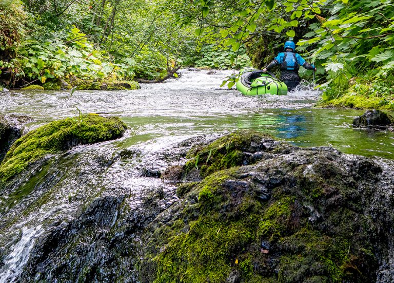 Dr. Jared Kern packrafting in the Chugach